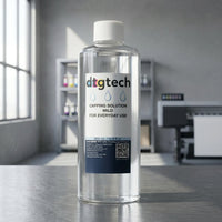 500ml Bottle of dtgtech capping solution on a reflective surface with a blurred office background