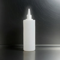 Opaque 500ml bottle with a nozzle on a light gray background