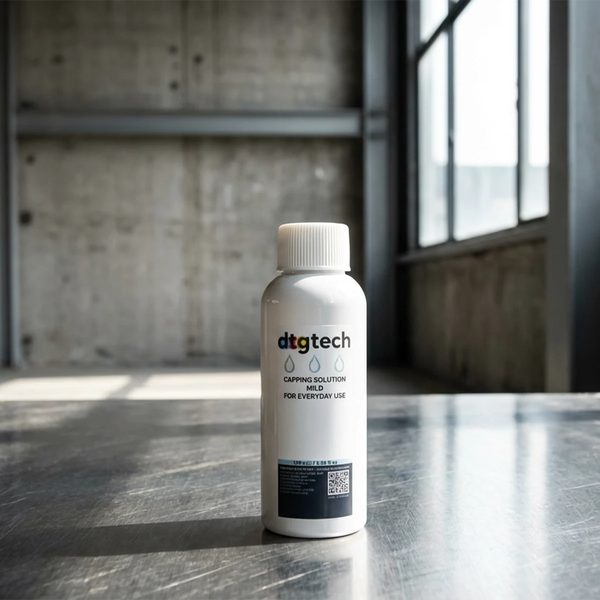 dtgtech wet csap 100ml bottle on a metallic surface with a concrete wall background